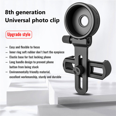 Telefone celular preto que mancha o adaptador do espaço para o monocular dos binóculos do telescópio